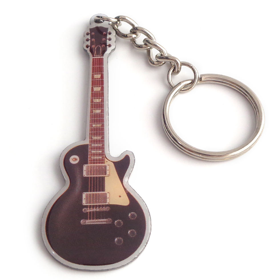 Kundenspezifischer brauner klassischer Gitarrengroßhandel mit Metallbasis-Charakter-Schlüsselanhänger